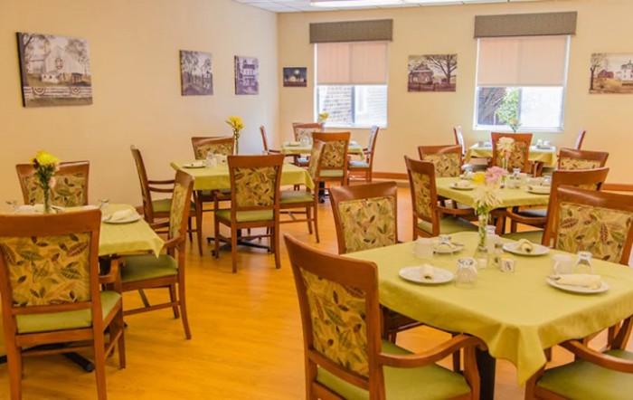 An inviting dining room with neatly arranged tables and chairs, ready for guests.