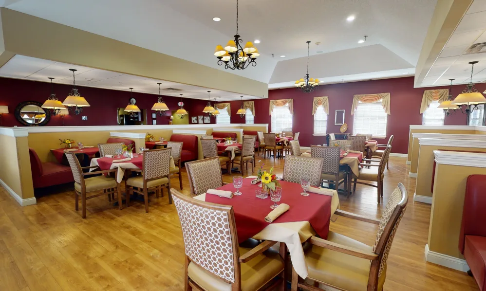 An elegant restaurant dining area with neatly arranged tables and chairs.