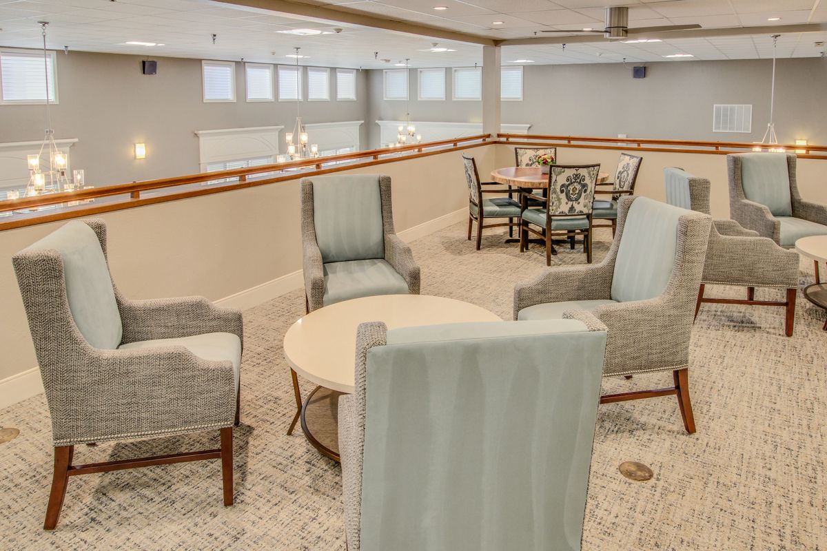 A modern lounge area with comfortable seating and a table arrangement.