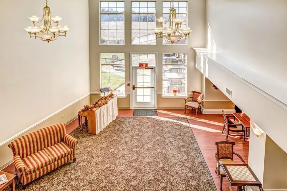 Spacious lobby area with elegant lighting and comfortable seating.
