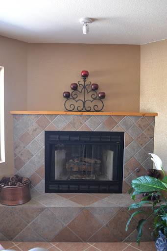 A cozy fireplace adorned with decorative elements, perfect for a warm home ambiance.