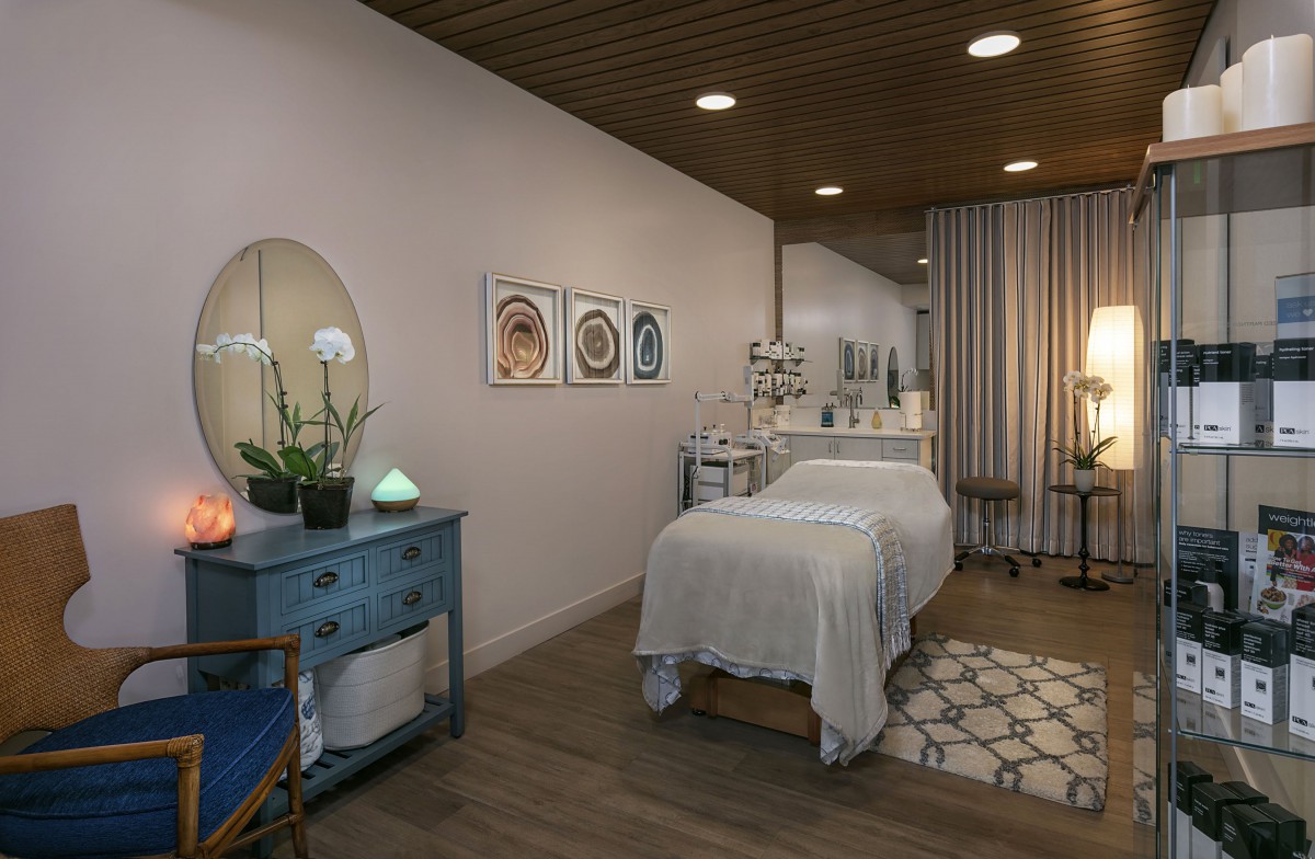 A tranquil spa massage room with soothing decor and ambient lighting.