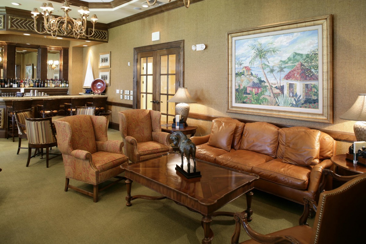 A well-appointed living room with leather furniture and elegant decor.