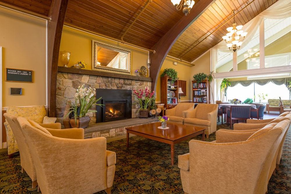 A warm and inviting living room with a fireplace and cozy seating.
