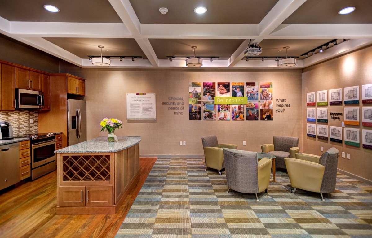 A cozy and welcoming lobby area with comfortable seating, decorative elements, and a reception desk.