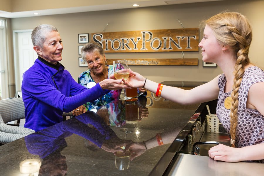 People enjoying a wine tasting experience at a winery.