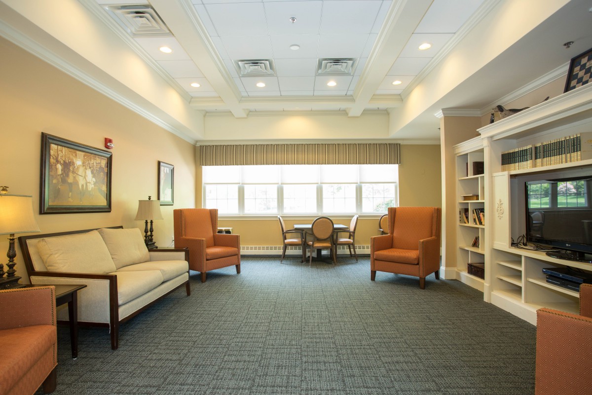 A cozy lounge area with comfortable seating and natural lighting.