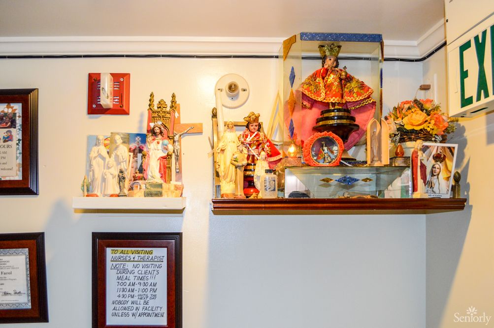A home altar adorned with various religious statues and icons.