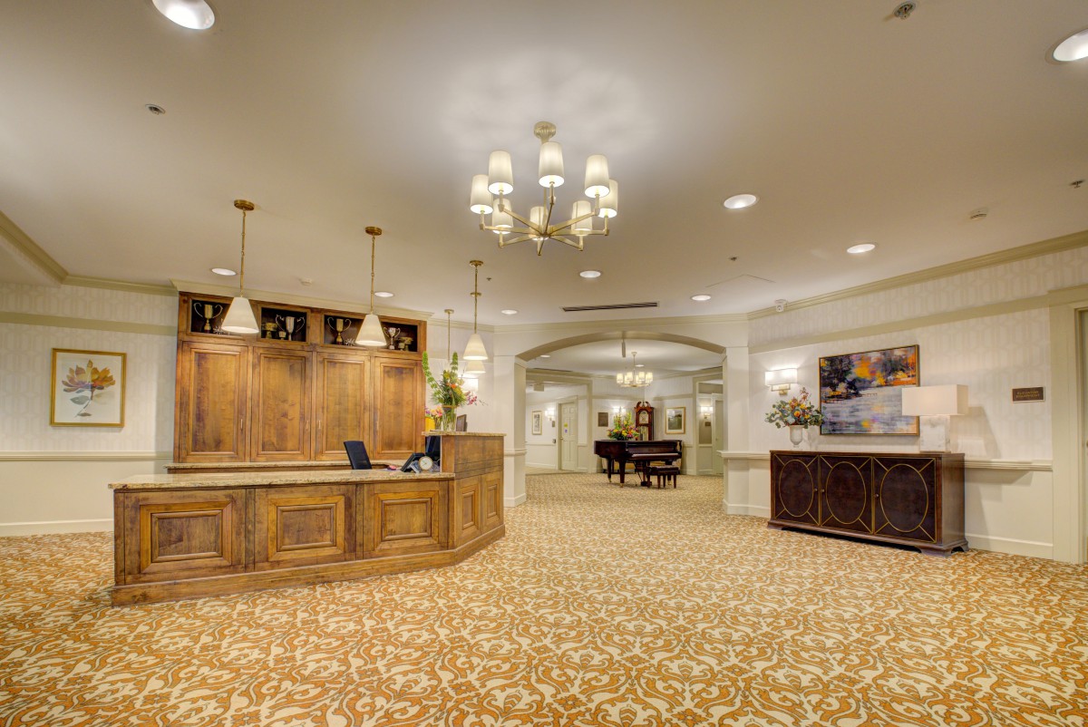 Elegant hotel lobby with a spacious reception area and warm lighting.