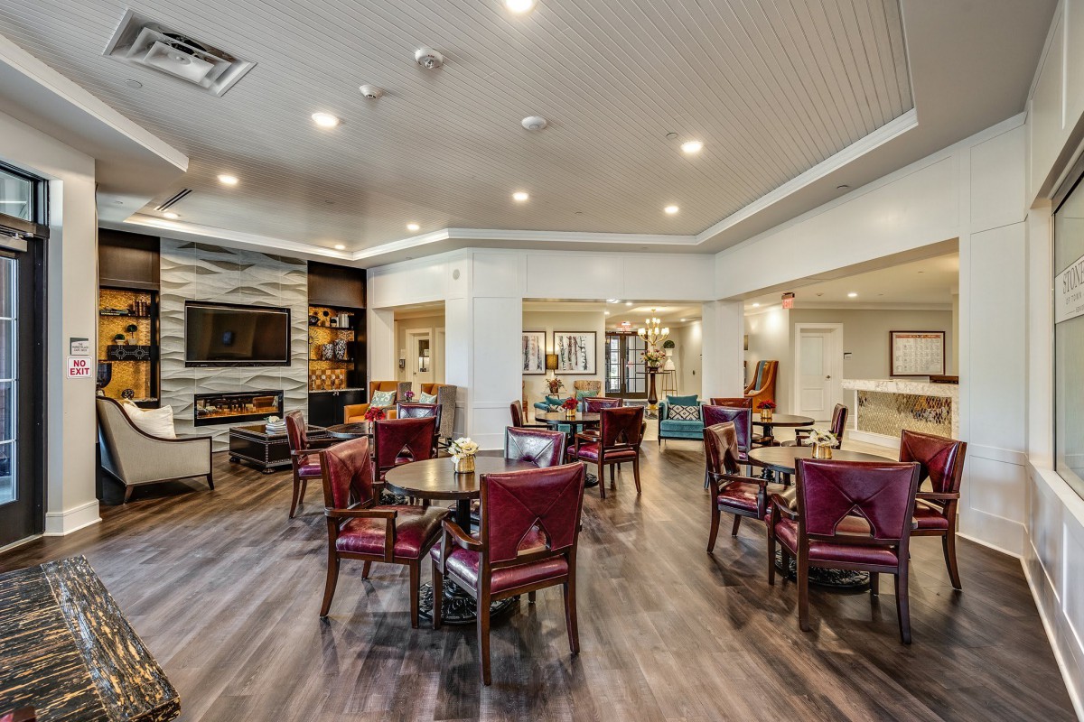 A modern dining area with elegant seating and ambient lighting.