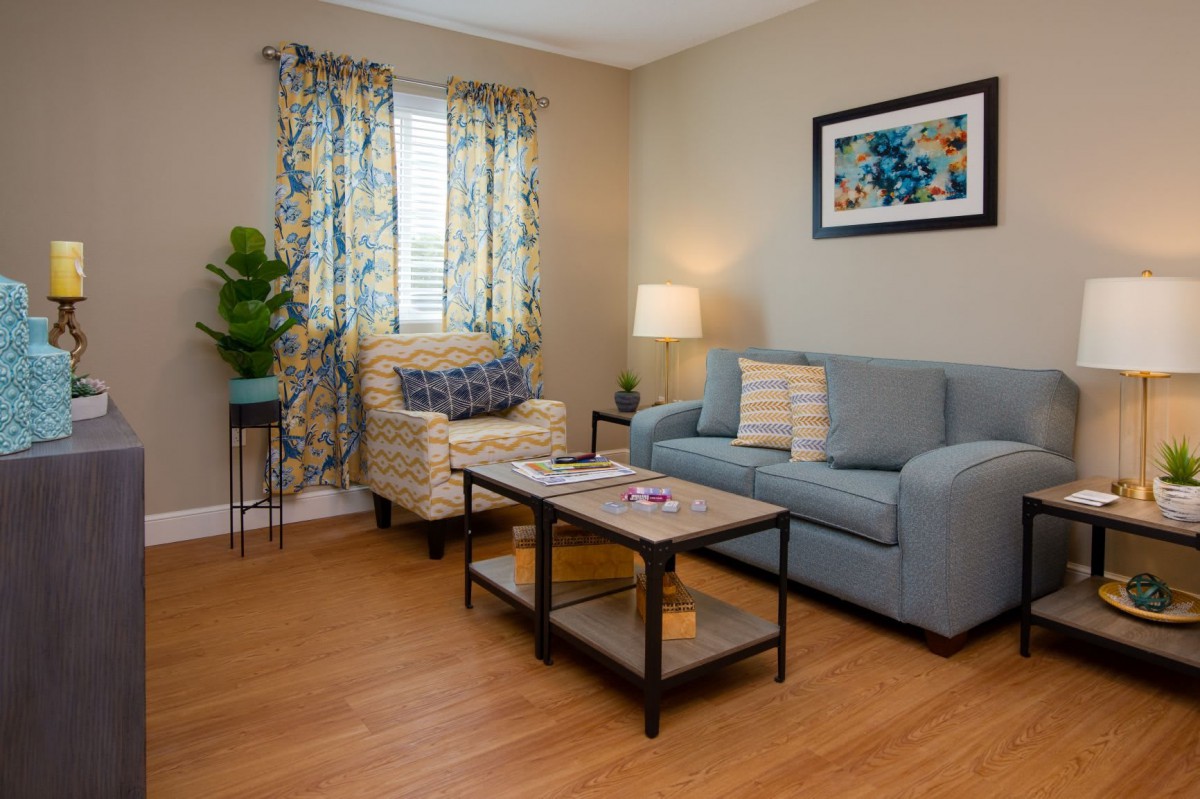 Cozy living room with modern furniture and decor.