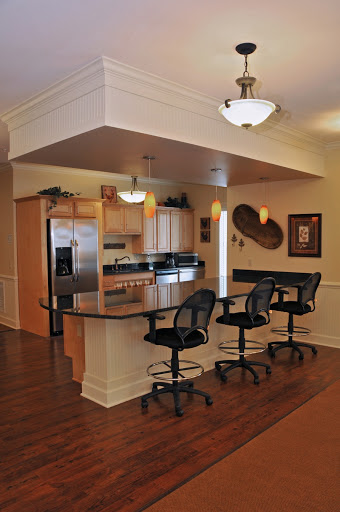 A modern kitchen featuring bar stools and an open design, perfect for entertaining.