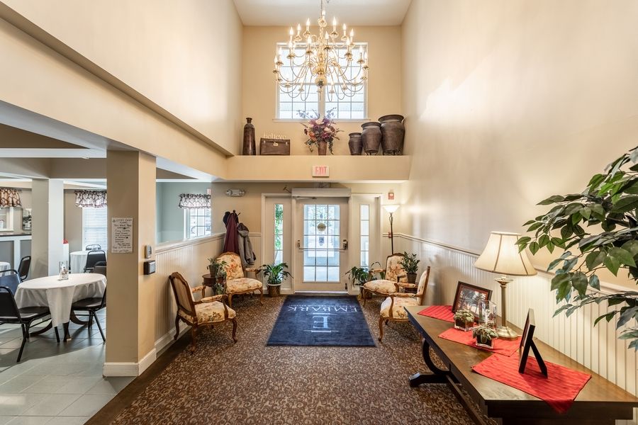 Elegant lobby with a grand chandelier and classic decor.