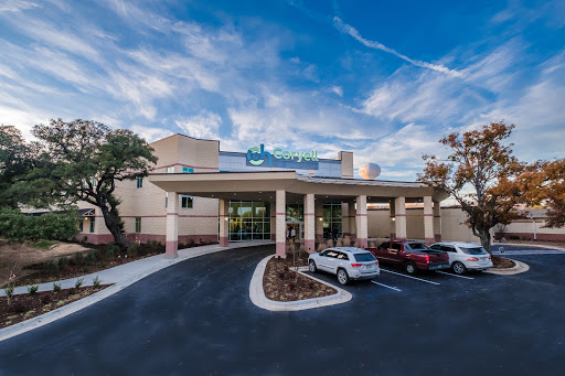 A modern healthcare facility featuring a welcoming entrance and well-maintained surroundings.