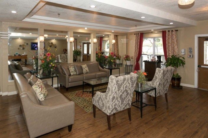 A spacious and elegantly designed living room with comfortable seating and stylish decor.