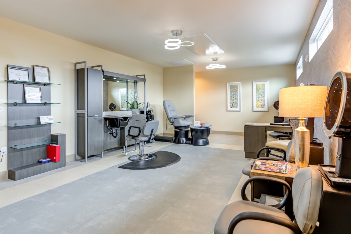 A modern salon interior with styling chairs and mirrors, designed for beauty treatments.