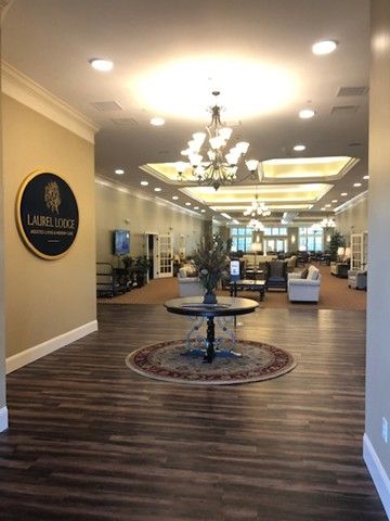 Elegant lobby with chandelier lighting and comfortable seating.