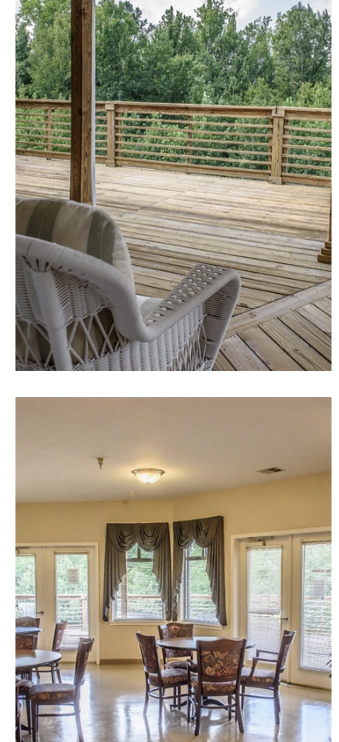 Wicker chair on a wooden deck and a ceiling light in an indoor setting.