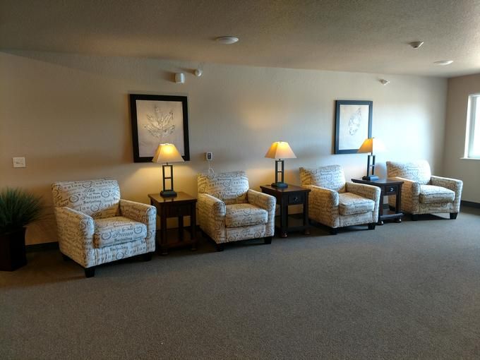 A cozy waiting area with comfortable chairs and ambient lighting.
