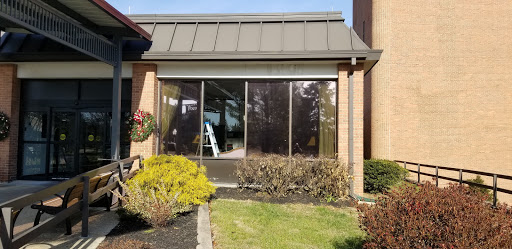 A view of the exterior glass facade of a commercial building.