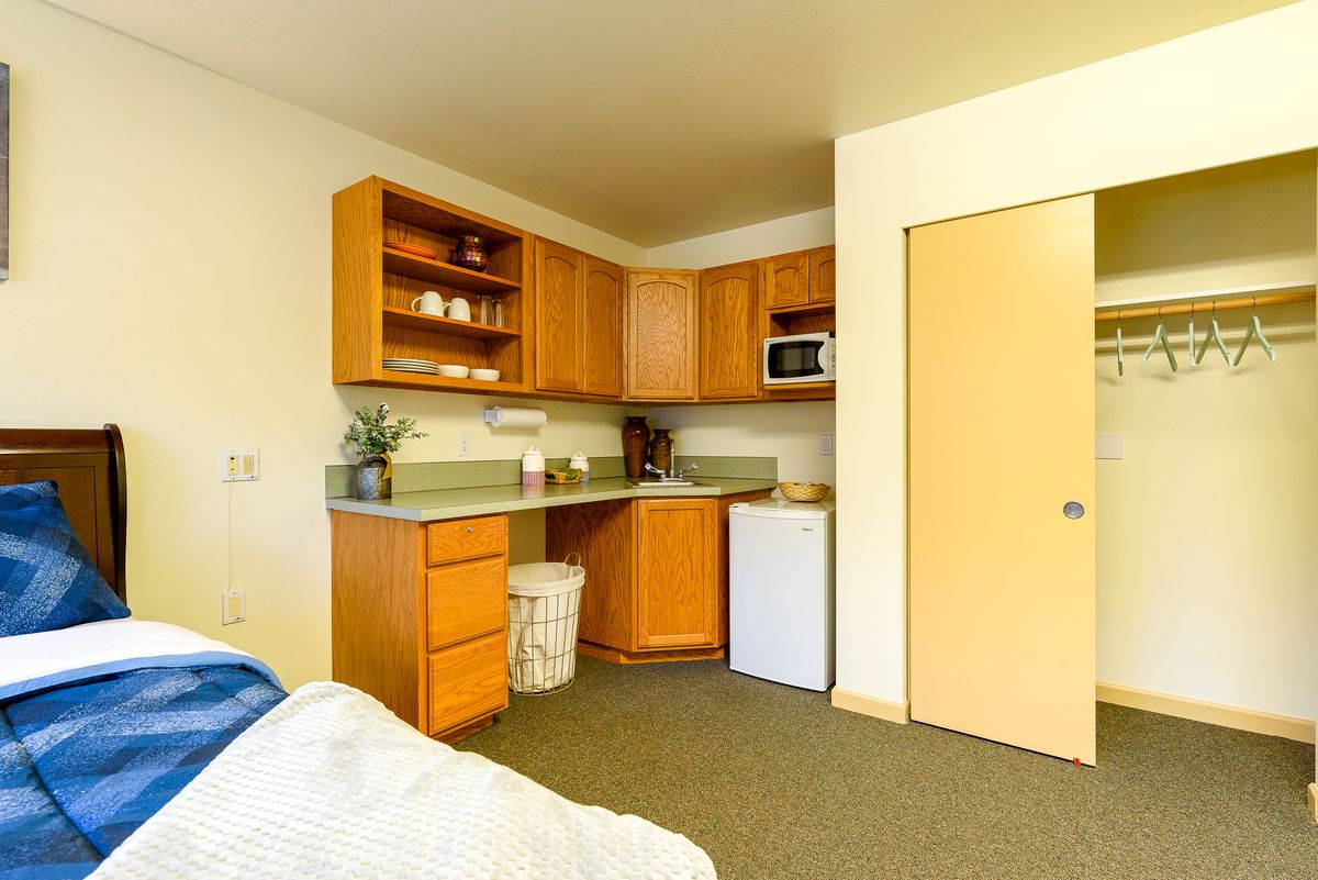 A cozy, compact kitchen area in a small apartment.
