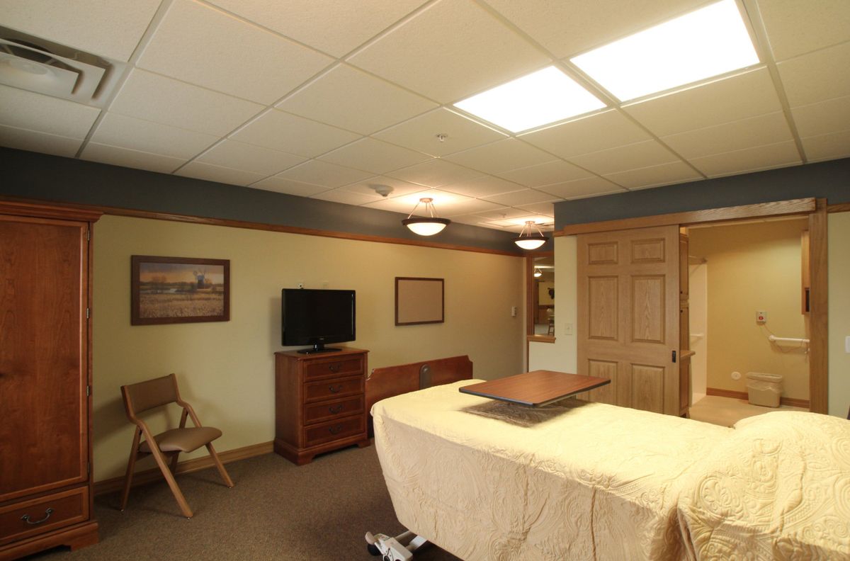 A tranquil massage room with a treatment table and calming decor.