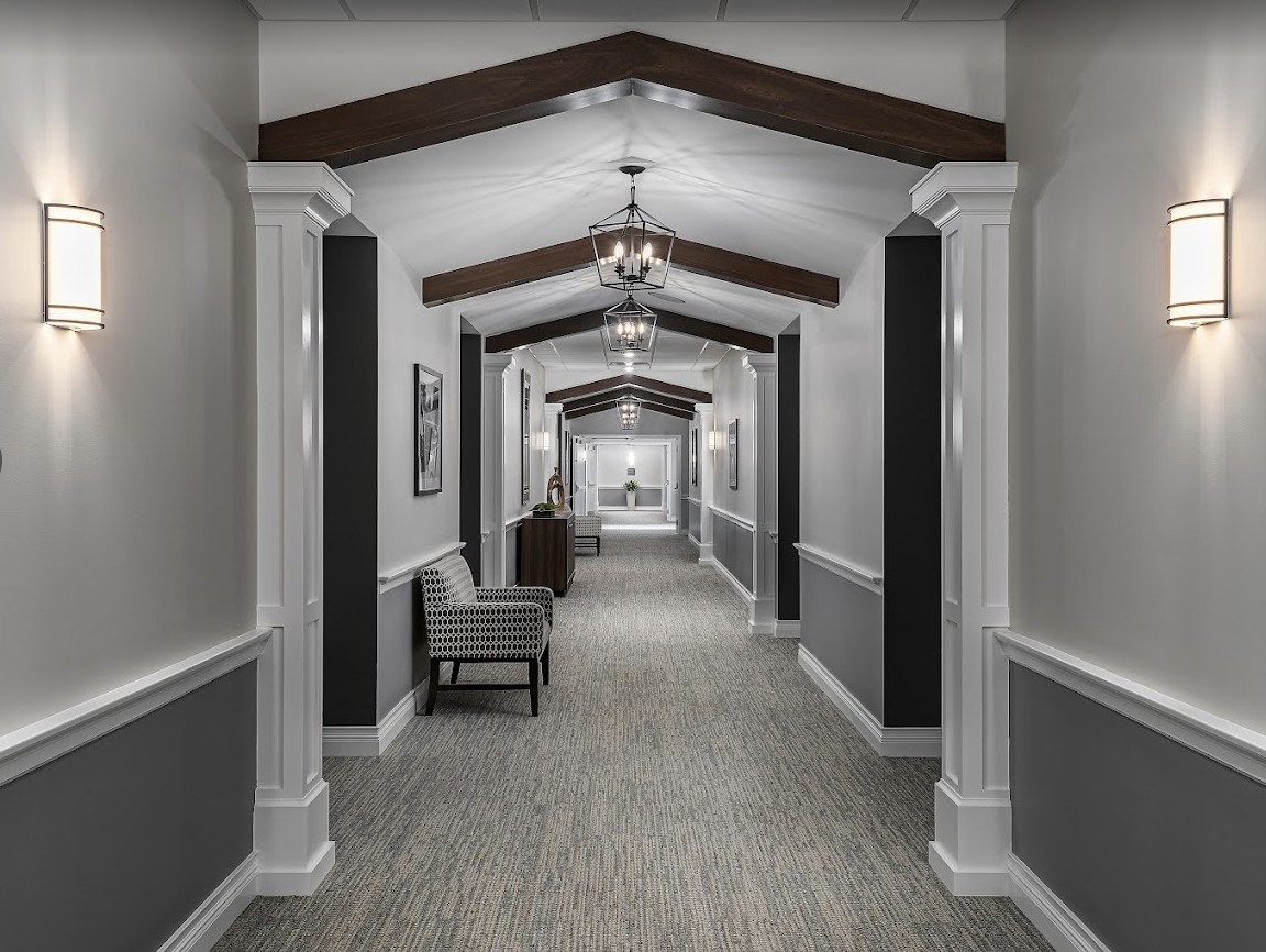 A modern hallway with elegant architectural design and lighting.