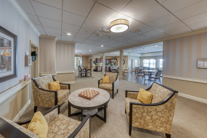 A cozy lounge area with comfortable seating and a central table.