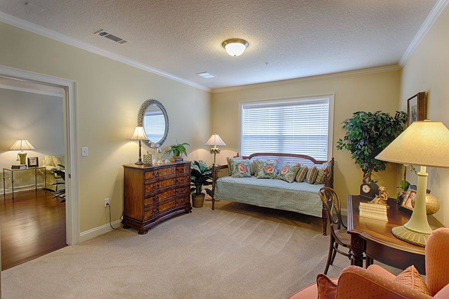 A cozy living room with a sofa, table, and decorative elements.