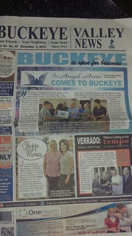 A newspaper featuring community news and local advertisements.