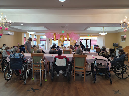 Residents participate in a community event at an assisted living facility.