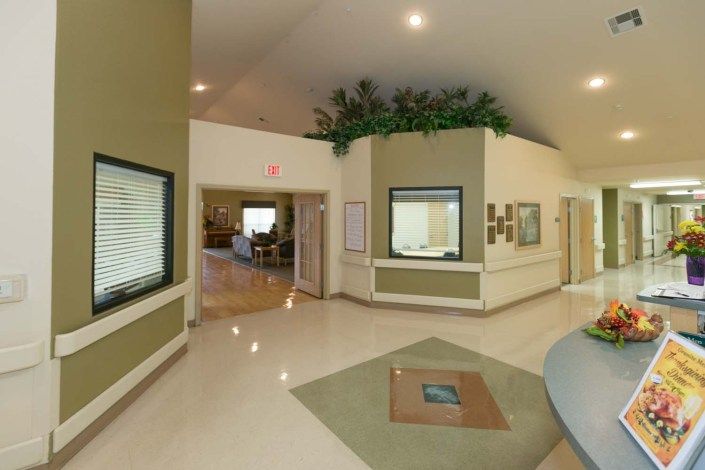 A modern reception area with plants and a clean, welcoming design.