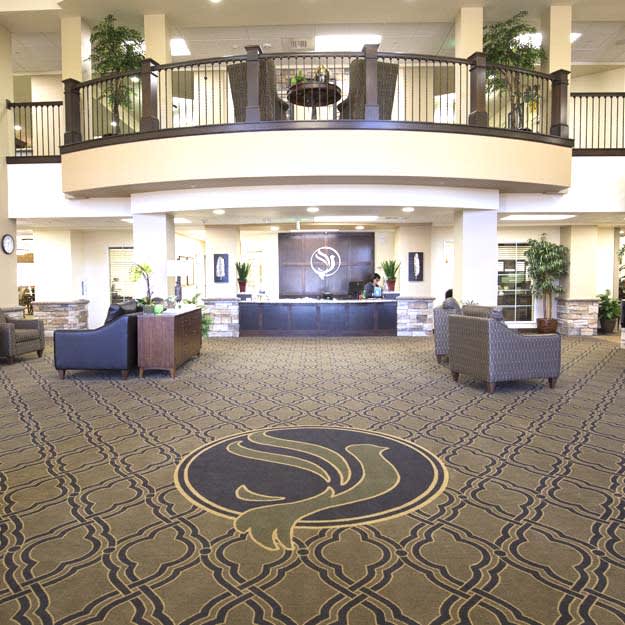 A modern hotel lobby with elegant decor and comfortable seating.