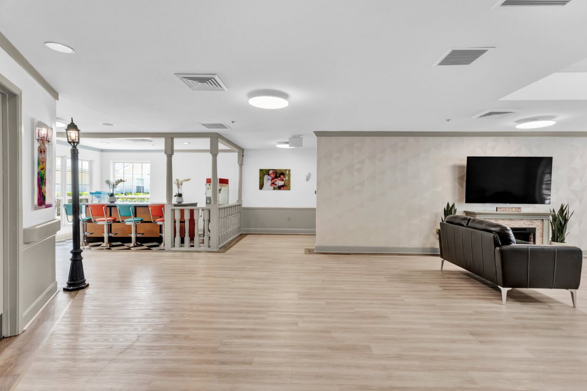 A modern living space with a cozy seating area and a children's play section.