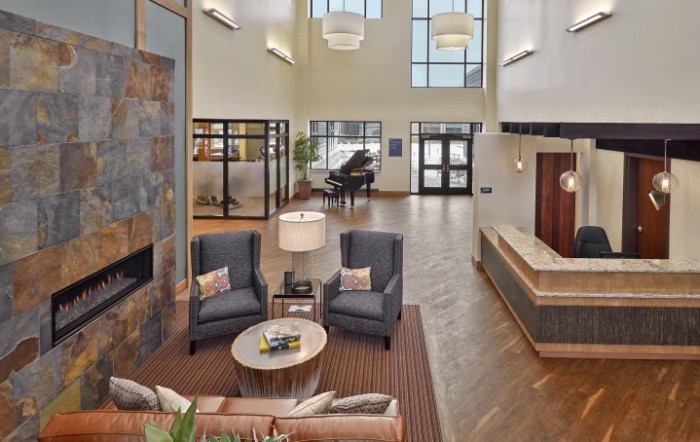 A modern and spacious lobby with comfortable seating and elegant decor.