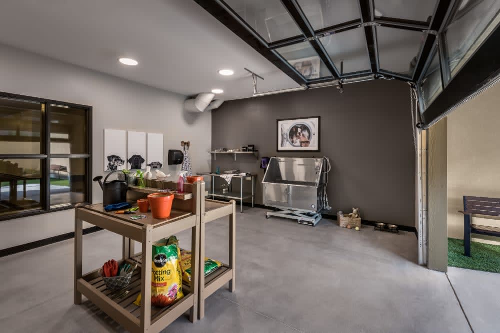 A well-organized garage with tools, shelves, and a workbench.