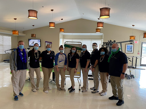 A dedicated team of healthcare professionals posing together.