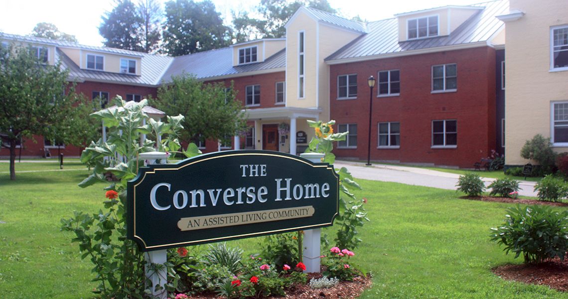 The Converse Home with its welcoming sign and well-maintained garden.