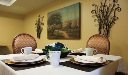 A beautifully arranged dining table with an artistic backdrop, perfect for a cozy gathering.