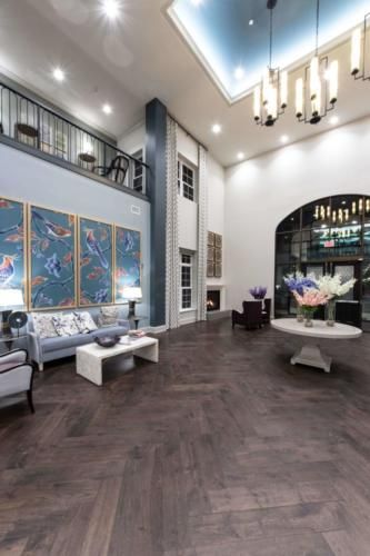 A modern lobby with stylish furniture, artwork, and elegant lighting.
