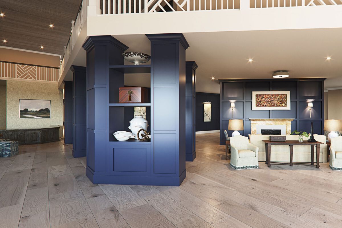 A modern living room with elegant interior design featuring open shelving and stylish furniture.