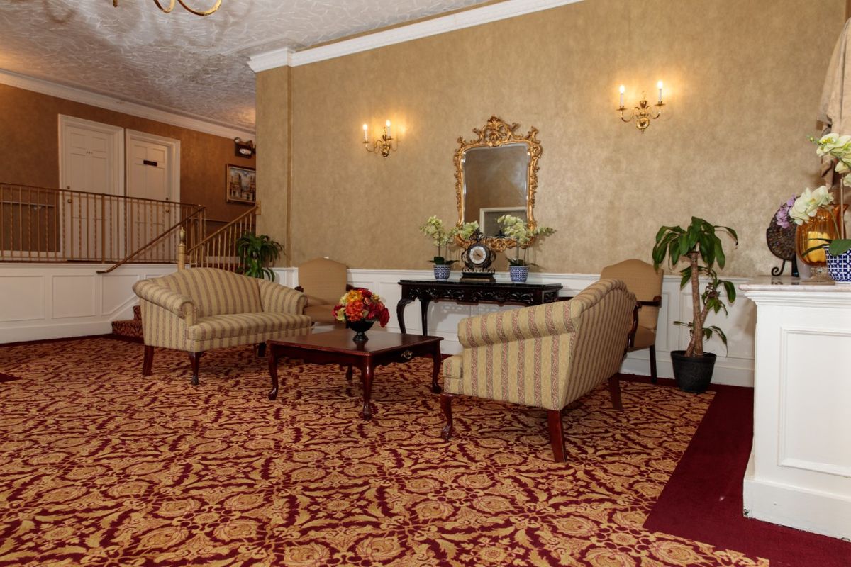 A hotel lobby with elegant seating and decorative elements.
