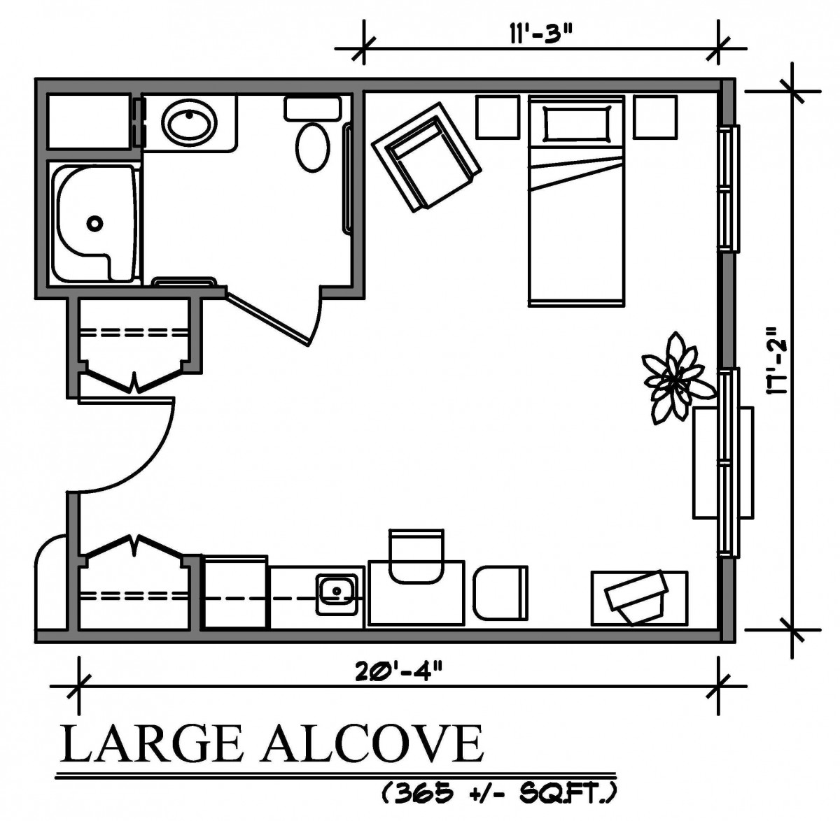 A floor plan of a large alcove studio apartment, featuring a bathroom, bed, sitting area, kitchen, and storage.