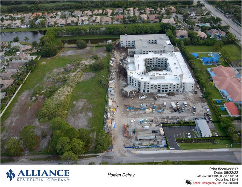 Aerial view of a construction site near a residential neighborhood.