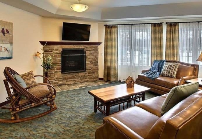 Cozy living room with a fireplace and comfortable seating.