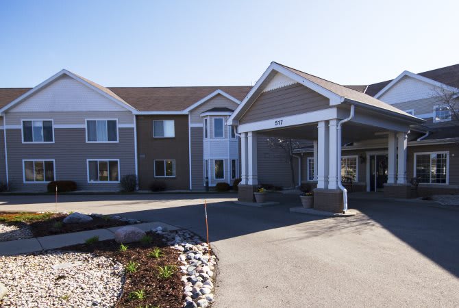 A modern hotel building with a welcoming entrance and well-maintained landscaping.