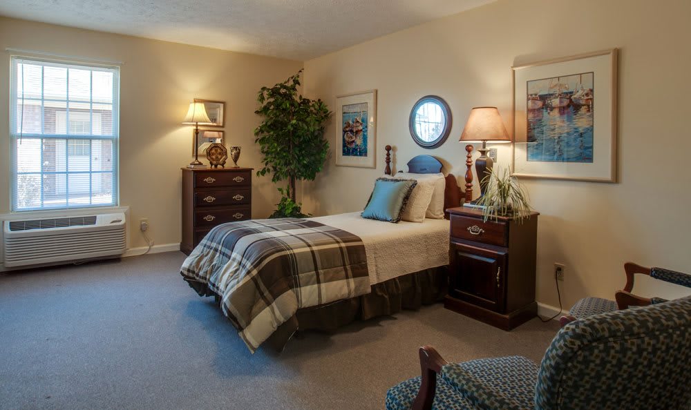 A cozy bedroom with warm lighting and classic furniture.