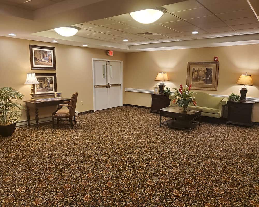 A cozy lobby area with seating and decor.