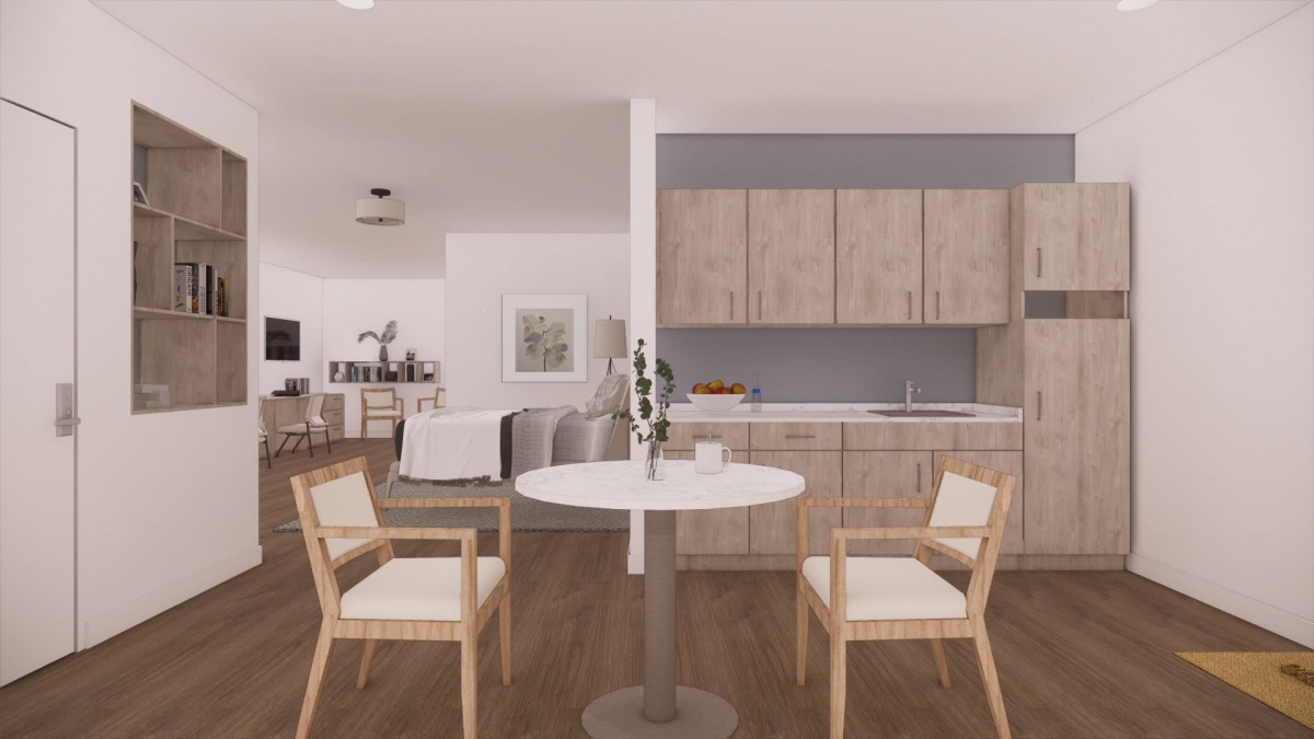 A modern open-plan kitchen and dining area with minimalist decor and wooden finishes.