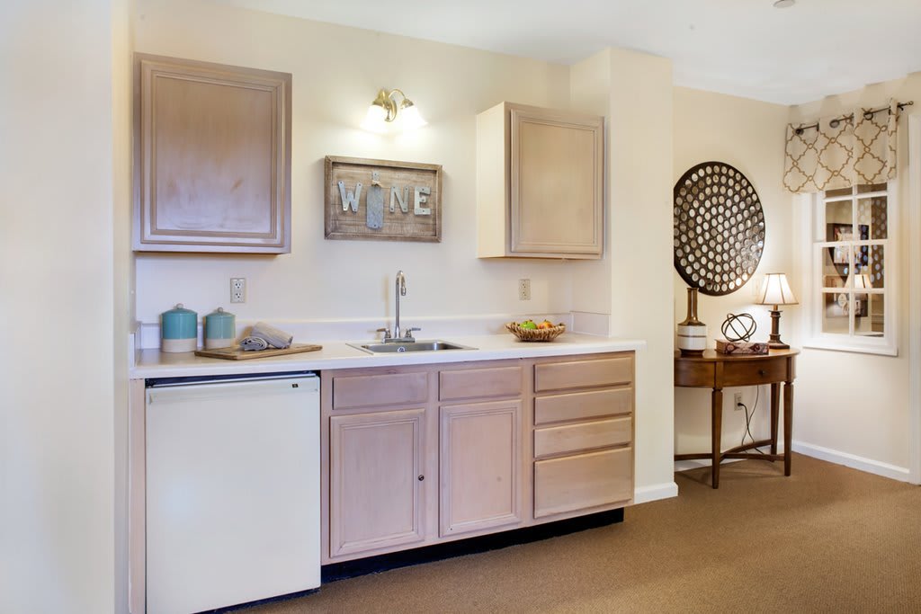 A cozy kitchen space with wooden cabinets and stylish decor.